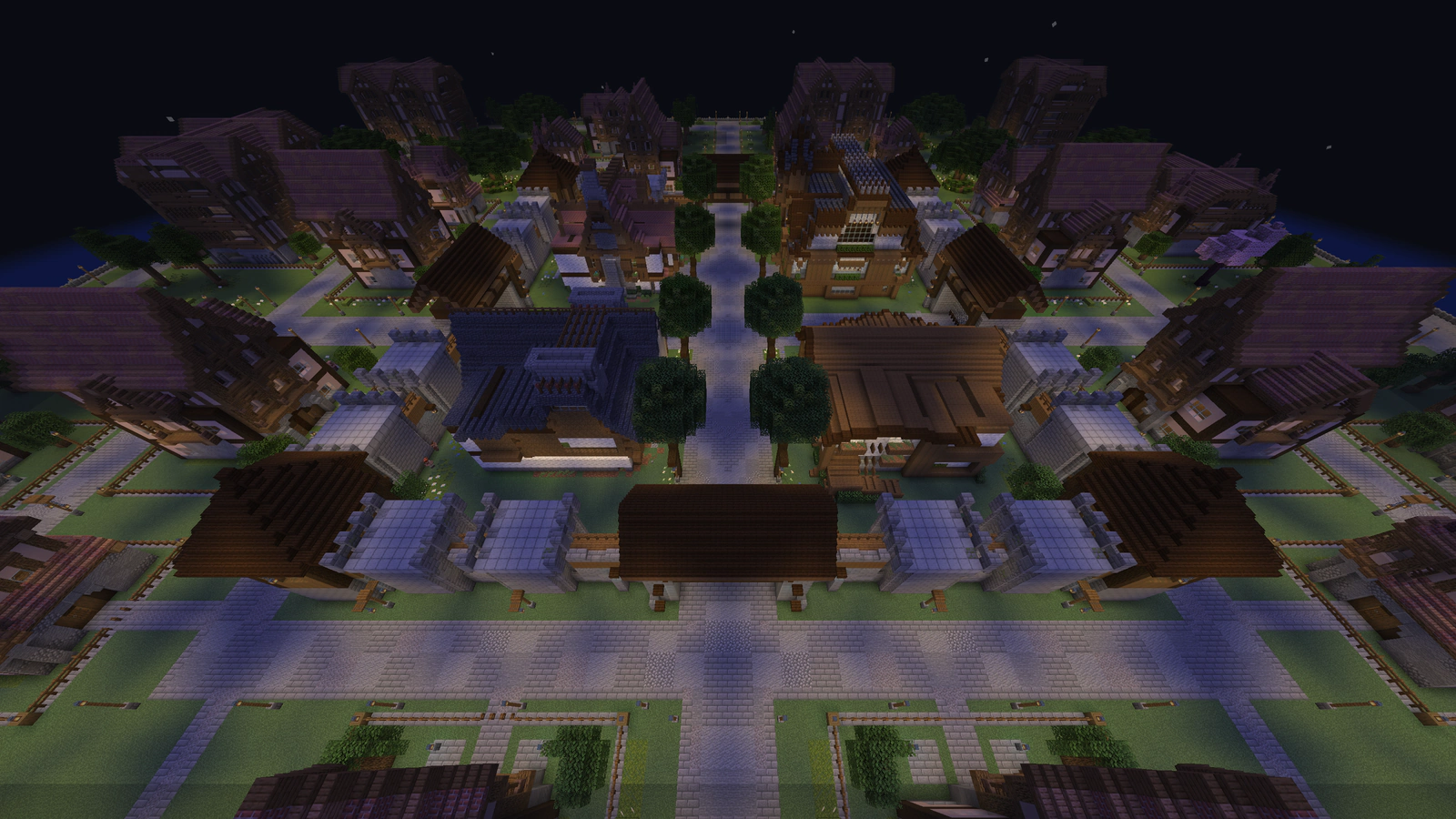 The four central Village buildings and surrounding Homeland homes at night.